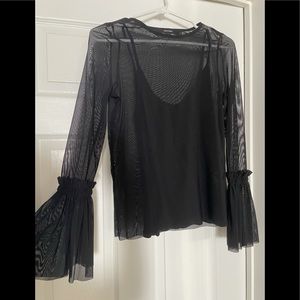 Sheer blouse with black underlay. Butterfly sleeves